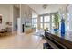 Open concept living room with a grand piano and high ceilings with large windows at 2732 Canebreak Ln, Mount Pleasant, SC 29466