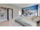 Bright main bedroom with a striking waterfall mural, light wood floors, and plenty of natural light at 2732 Canebreak Ln, Mount Pleasant, SC 29466