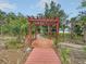 Charming wooden pergola surrounded by trees, creating a peaceful retreat at 2732 Canebreak Ln, Mount Pleasant, SC 29466
