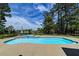 Lush backyard showcasing a sparkling blue swimming pool with an attached hot tub at 2732 Canebreak Ln, Mount Pleasant, SC 29466
