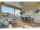 Inviting screened porch with modern furniture and tranquil views of the neighborhood at 2732 Canebreak Ln, Mount Pleasant, SC 29466
