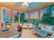 Relaxing screened porch with outdoor seating and a beautiful view of the sunset at 2732 Canebreak Ln, Mount Pleasant, SC 29466