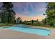 Resort-style swimming pool with a spa, manicured landscaping, and scenic views at sunset at 2732 Canebreak Ln, Mount Pleasant, SC 29466