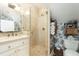 Updated bathroom with a glass enclosed shower, new vanity, and stylish fixtures at 29 1/2 State St # B, Charleston, SC 29401