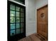 Elegant entrance featuring a decorative wooden door and transom window, adding architectural interest at 29 1/2 State St # B, Charleston, SC 29401