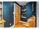 Bright entryway featuring hardwood floors, and detailed woodworking next to the front door at 29 1/2 State St # B, Charleston, SC 29401