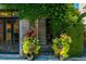 Charming front entrance with lush greenery and unique brick archway, adding to curb appeal at 29 1/2 State St # B, Charleston, SC 29401