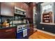 Modern kitchen with stainless steel appliances, granite countertops, and a professional-grade stove and oven at 29 1/2 State St # B, Charleston, SC 29401