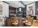 Stylish kitchen showcasing dark cabinets, stainless steel appliances, and a center island with bar seating at 29 1/2 State St # B, Charleston, SC 29401