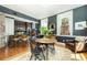 Inviting living room featuring an open floor plan, hardwood floors, and a modern kitchen with stainless steel appliances at 29 1/2 State St # B, Charleston, SC 29401