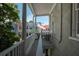Relaxing porch overlooking quaint homes and a waving American flag at 29 1/2 State St # B, Charleston, SC 29401
