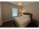 Bedroom with hardwood flooring, a cozy bed, and a window for natural light at 3017 Ashburton Way, Mount Pleasant, SC 29466