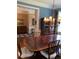 Dining room with hardwood floors, wainscotting and elegant lighting with a view to the entry hall at 3017 Ashburton Way, Mount Pleasant, SC 29466