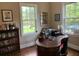Office space with natural light, a beautiful wood desk and bookshelf, and hardwood floors at 3017 Ashburton Way, Mount Pleasant, SC 29466