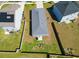 Aerial view of a home with a fenced backyard and green space, located between neighboring houses at 303 Feldspar Ln, Ladson, SC 29456