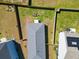 Aerial view of a fenced backyard with a seating area and a well-maintained lawn at 303 Feldspar Ln, Ladson, SC 29456