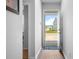Inviting entryway showcasing hardwood floors and a view of the well-manicured front yard at 303 Feldspar Ln, Ladson, SC 29456