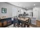 Bright kitchen featuring white cabinets, granite countertops, stainless steel appliances, and modern fixtures at 303 Feldspar Ln, Ladson, SC 29456
