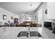 Bright kitchen featuring white cabinets, granite countertops, stainless steel appliances, and modern fixtures at 303 Feldspar Ln, Ladson, SC 29456
