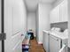 Functional laundry room featuring modern washer, dryer, and ample storage cabinets at 303 Feldspar Ln, Ladson, SC 29456