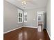 Bright bedroom boasts hardwood floors, modern ceiling fan, and trimmed windows with shutter blinds at 304 Pimpernel St, Summerville, SC 29483