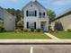 Inviting two-story home with manicured lawn and charming front porch at 304 Pimpernel St, Summerville, SC 29483