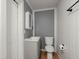 Bathroom featuring a pedestal sink, toilet, medicine cabinet, and new fixtures at 3113 Matipan Ave, North Charleston, SC 29405