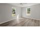 Bright bedroom featuring hardwood flooring and natural light streaming through the dual windows at 3113 Matipan Ave, North Charleston, SC 29405