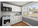 Updated kitchen features white cabinets, new microwave, and range at 3113 Matipan Ave, North Charleston, SC 29405