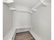 Organized walk-in closet with shelving, hanging racks and hardwood flooring for ample storage at 3113 Matipan Ave, North Charleston, SC 29405
