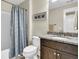 Bathroom featuring granite countertops, dark wood cabinets and a shower with a blue striped curtain at 315 Fish Creek Ct, Summerville, SC 29486