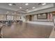 Bright event space with chandeliers, stage, and American flag, perfect for large gatherings and special occasions at 315 Fish Creek Ct, Summerville, SC 29486