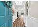Bright foyer with hardwood floors, wainscoting and a view to rooms beyond at 315 Fish Creek Ct, Summerville, SC 29486