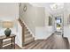 Welcoming foyer with wood floors, staircase, and view of the home's exterior at 315 Fish Creek Ct, Summerville, SC 29486