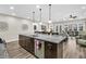 Gourmet kitchen with granite island open to dining area and living room, perfect for entertaining at 315 Fish Creek Ct, Summerville, SC 29486