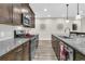 Updated kitchen with stainless steel appliances, granite countertops, white backsplash, and hardwood flooring at 315 Fish Creek Ct, Summerville, SC 29486