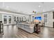 Bright living room with hardwood floors, ample seating, and large windows providing natural light at 315 Fish Creek Ct, Summerville, SC 29486