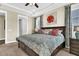 Comfortable main bedroom featuring a king-size bed, soft lighting, and neutral tones at 315 Fish Creek Ct, Summerville, SC 29486