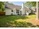Charming backyard with a well-maintained lawn and a patio set perfect for outdoor relaxation at 3222 Morningdale Dr, Mount Pleasant, SC 29466