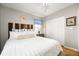 A cozy bedroom featuring natural light, hardwood floors, and calming neutral decor at 3222 Morningdale Dr, Mount Pleasant, SC 29466