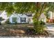 A well kept home with an inviting front yard, mature trees, and a cozy, covered entrance at 3222 Morningdale Dr, Mount Pleasant, SC 29466