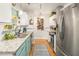 Well-lit kitchen featuring modern stainless steel appliances, granite countertops, and blue lower cabinetry at 3222 Morningdale Dr, Mount Pleasant, SC 29466