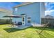 Spacious backyard with a patio area, outdoor dining set, hammock, and lush green lawn, perfect for outdoor enjoyment at 328 Bradley Bend Dr, Moncks Corner, SC 29461