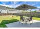 Lush backyard with a patio, outdoor furniture, and a well-maintained lawn, perfect for outdoor relaxation at 328 Bradley Bend Dr, Moncks Corner, SC 29461