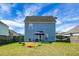 A spacious backyard with a well-maintained lawn, patio furniture, and a relaxing hammock, perfect for outdoor enjoyment at 328 Bradley Bend Dr, Moncks Corner, SC 29461