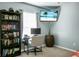 Comfortable bedroom featuring a desk, wall-mounted television, and ample natural light at 328 Bradley Bend Dr, Moncks Corner, SC 29461