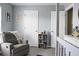 Serene Bedroom with comfortable rocking chair, soft lighting, and calming neutral colors at 328 Bradley Bend Dr, Moncks Corner, SC 29461