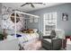 Charming bedroom with a four-poster bed, floral wallpaper, and a cozy armchair at 328 Bradley Bend Dr, Moncks Corner, SC 29461