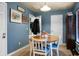 Cozy dining room boasts a round table, four chairs, and warm, inviting colors at 328 Bradley Bend Dr, Moncks Corner, SC 29461