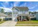 Charming two-story home features light-blue siding, manicured lawn, and attached garage at 328 Bradley Bend Dr, Moncks Corner, SC 29461